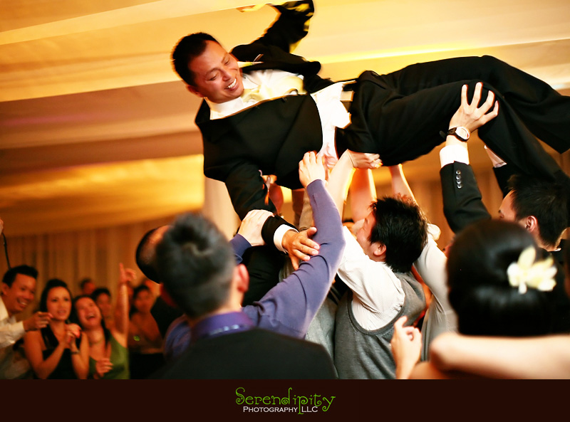 groom being tossed in the air groom being tossed in the air
