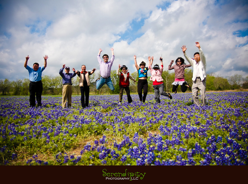 jumping picture in a field of bluebonnets