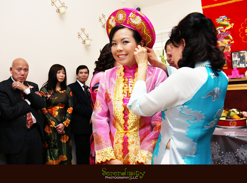  tea ceremony, Buddhist temple, kim son, Vietnamese wedding, mother-in-law putting earring on for bride
