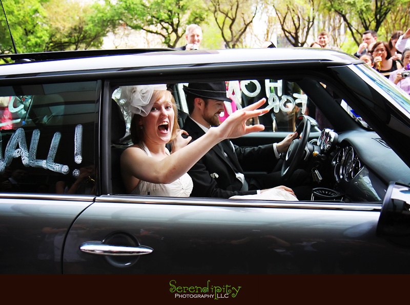 bride and groom leaving in a mini