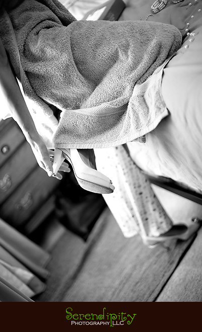 bride putting shoes on