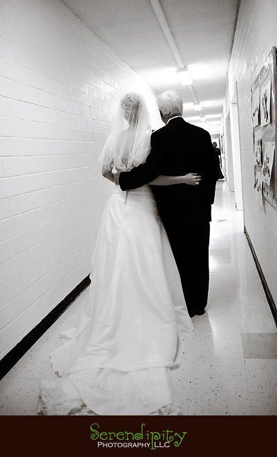 houston wedding photographer, bride and father of the bride walking down the hallway