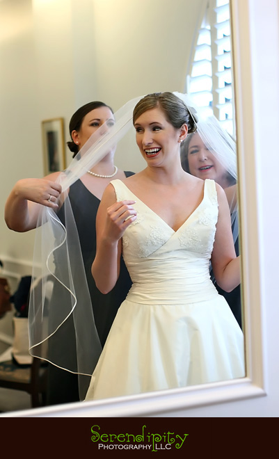 houston wedding photographer Magnolia Hotel bride putting on veil