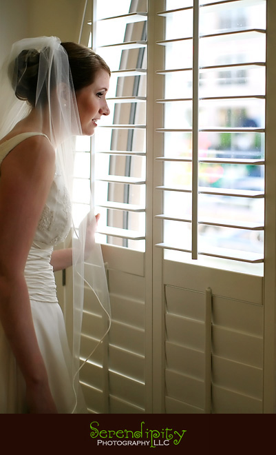 houston wedding photographer, Magnolia Hotel, bride looking out the window