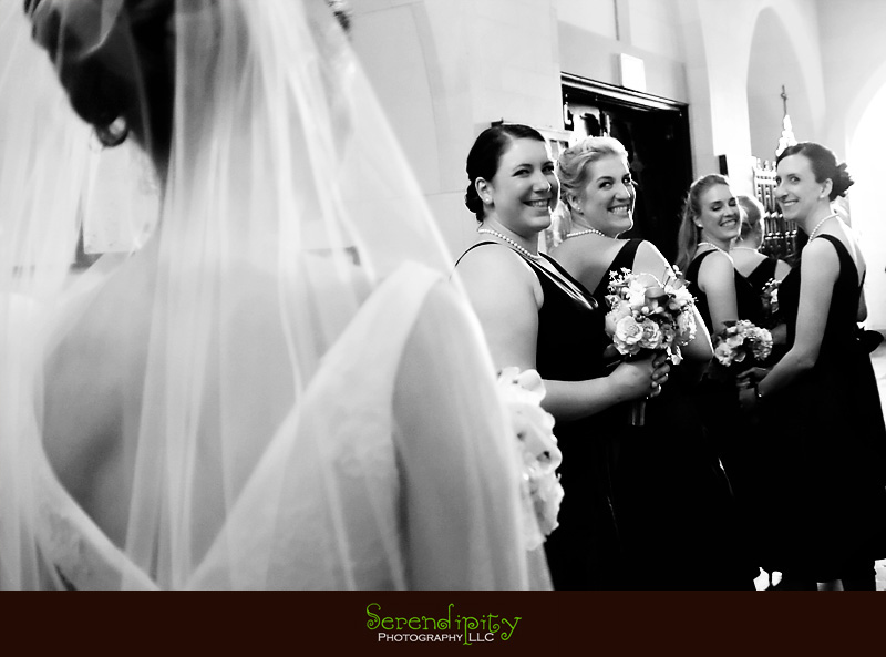houston wedding photographer, Magnolia Hotel, bridesmaids looking at bride