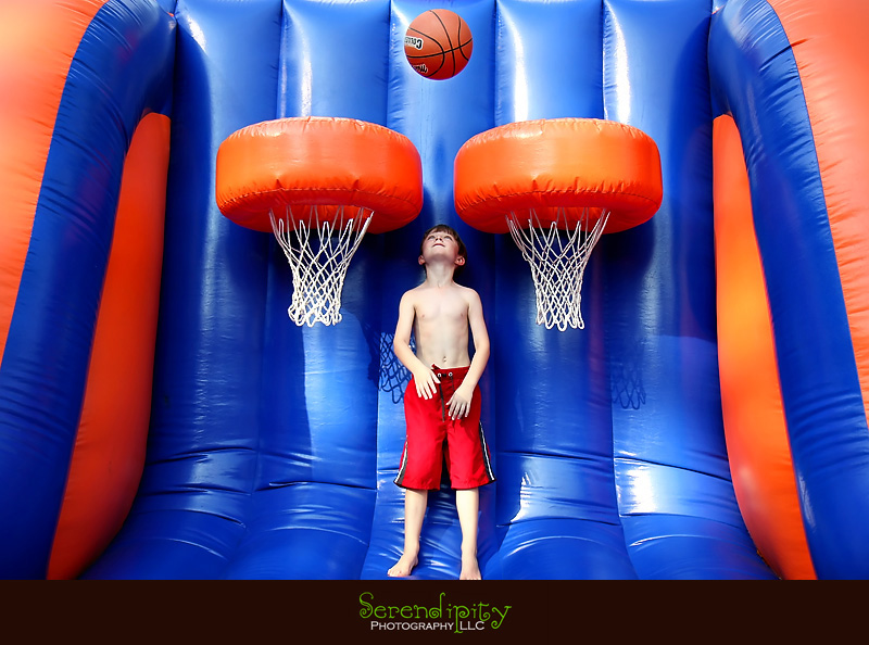 River Oaks Photography, Children Birthday Party Photography, birthday boy playing on moonwalk basketball