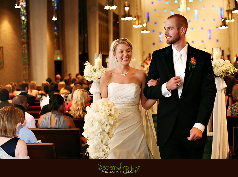 Houston wedding photographer, St Michael Catholic Church, Houstonian Resort and Spa, bride and groom walking out of church as husband and wife