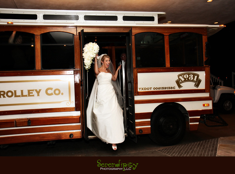Houston wedding photographer, St Michael Catholic Church, Houstonian Resort and Spa, bride getting off trolley
