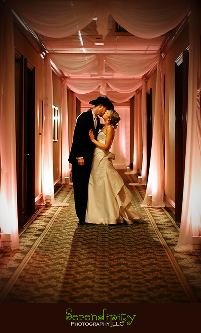 Houston wedding photographer, St Michael Catholic Church, Houstonian Resort and Spa, bride and groom kissing during grand exit