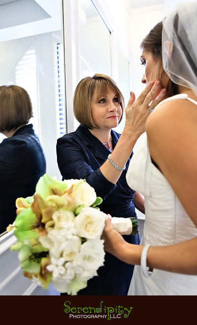 Houston wedding photographer, Holy Rosary, Houston Museum of Natural Science, mother of the bride looking at the bride with love