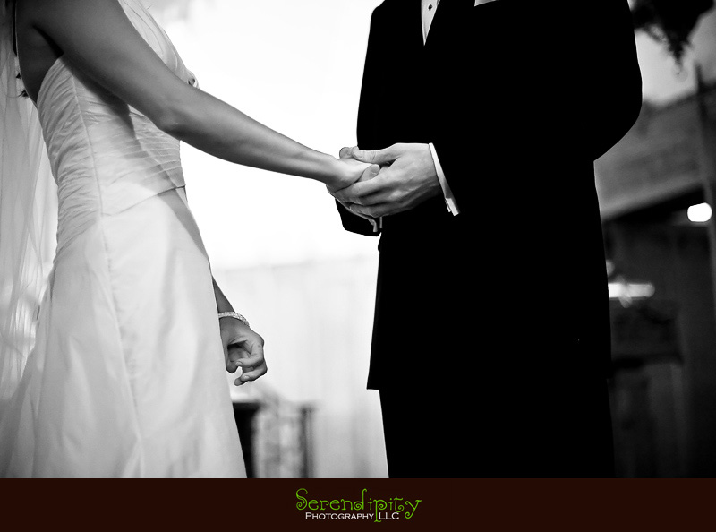 Houston wedding photographer, Holy Rosary, Houston Museum of Natural Science, groom holding brides hand during ceremony