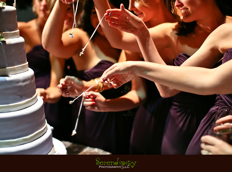 Houston wedding photographer, Holy Rosary, Houston Museum of Natural Science, bridesmaids pulling out their wedding cake charms