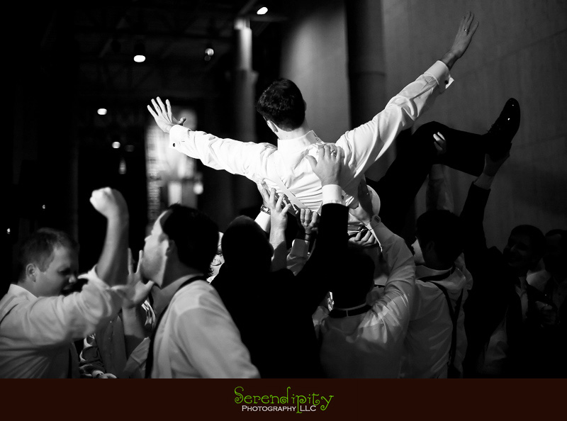 Houston wedding photographer, Holy Rosary, Houston Museum of Natural Science, groomsmen lifting the groom up in the air