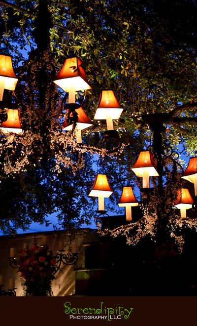 Houston wedding photographer, Villa Rinata, chandeliers lit up during twilight