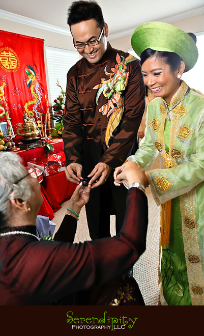 Houston wedding photographer, Vietnamese Wedding, bride and groom giving tea to grandma during tea ceremony