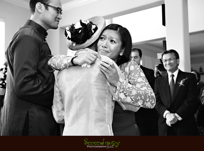 Houston wedding photographer, Vietnamese Wedding, bride's sister and bride hugging getting emotional