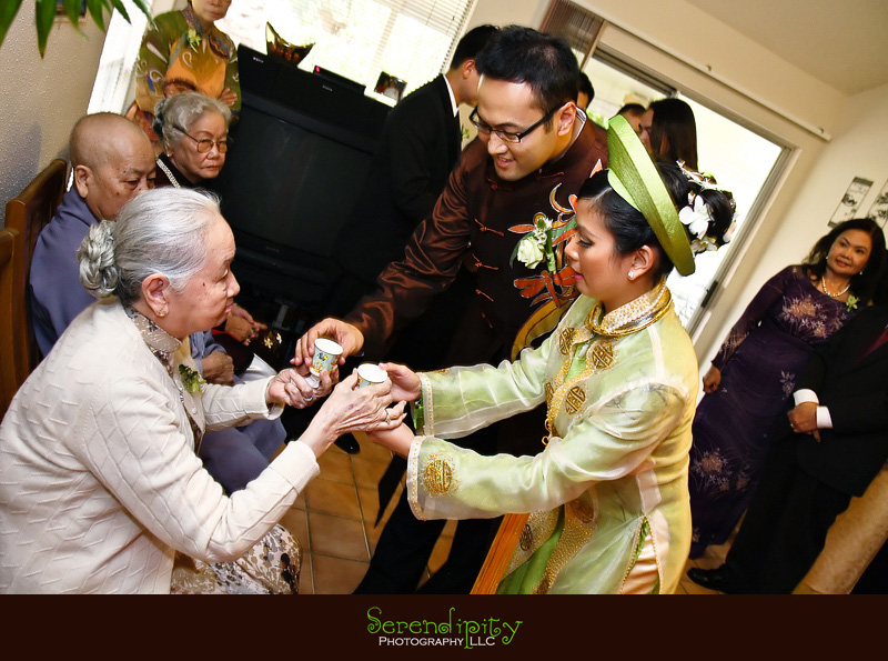 Houston wedding photographer, Vietnamese Wedding, bride and groom serving grandma some tea