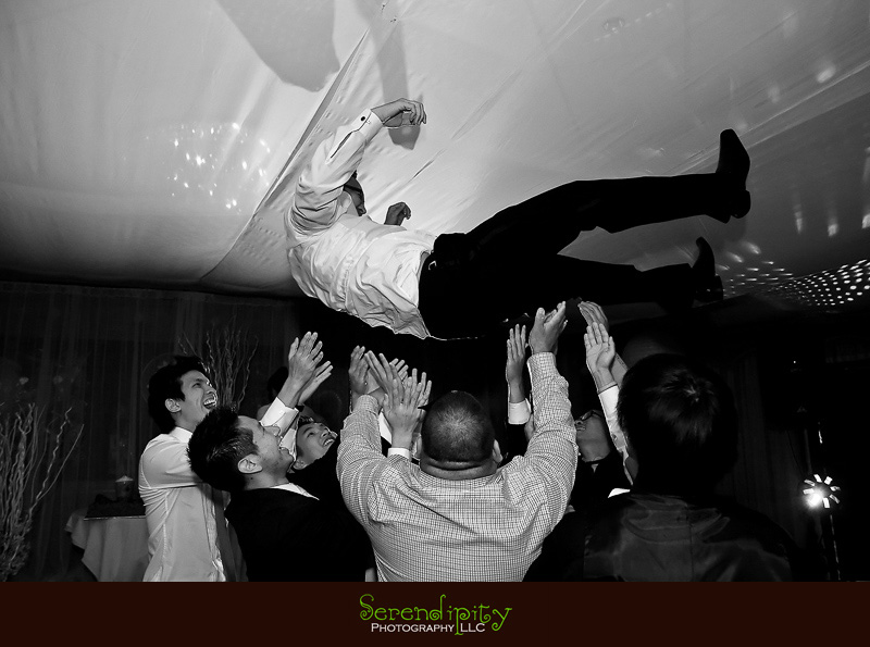 Houston wedding photographer, Vietnamese Wedding, groom heaved in the air