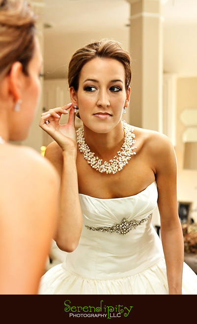 Houston wedding photographer, St George Orthodox Christian Church Ceremony, Alden Hotel Reception, bride putting on earring