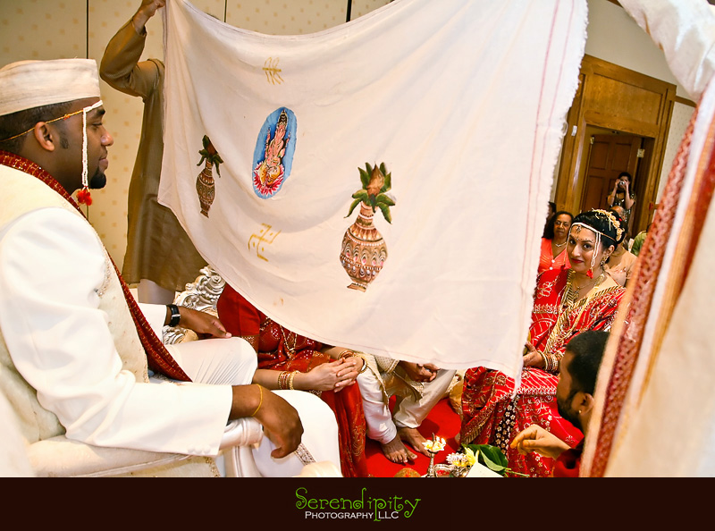 Houston Indian wedding photography, Marriott Hotel, cloth blocking groom from seeing the bride