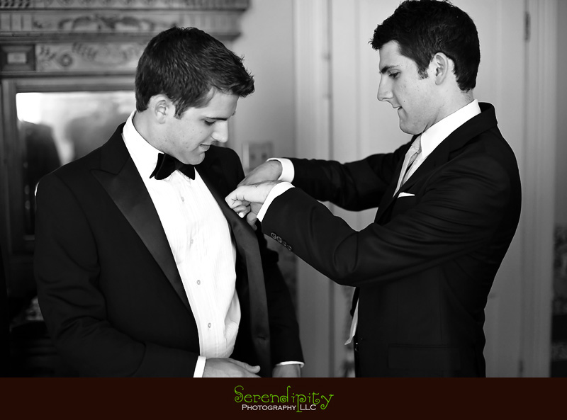 Austin wedding photography, outdoor ceremony, Barr Mansion, groom's twin brother helping him put on jacket