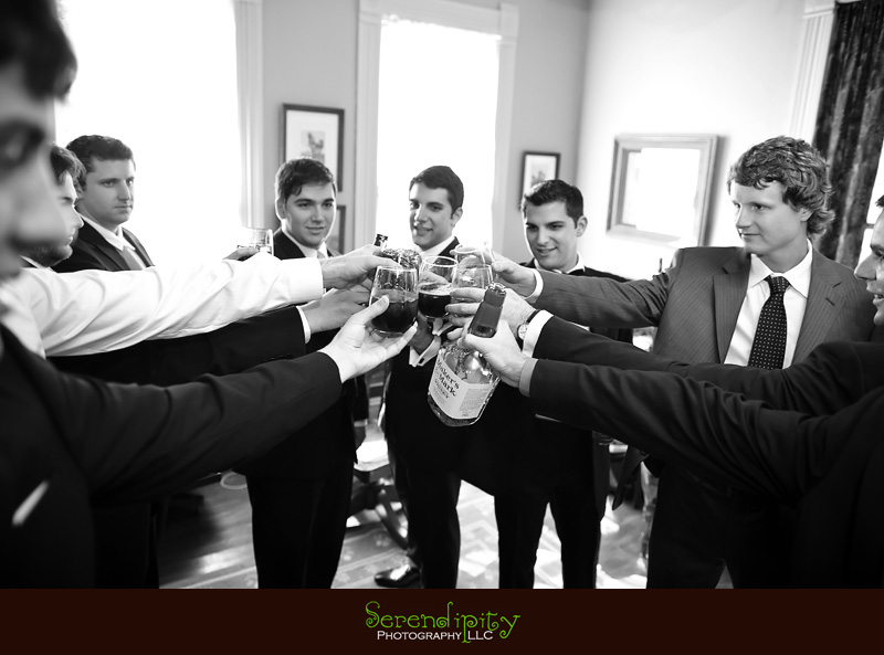 Austin wedding photography, outdoor ceremony, Barr Mansion, groom and groomsmen raising their glasses together